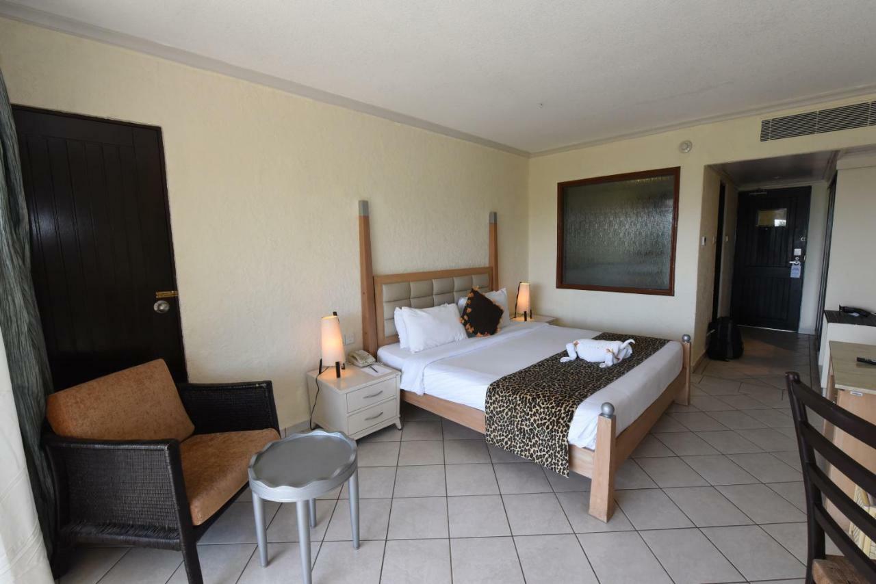 Diani Reef Beach Resort & Spa - Your Beachfront Bliss Awaits Diani Beach Exterior photo A room at the hotel