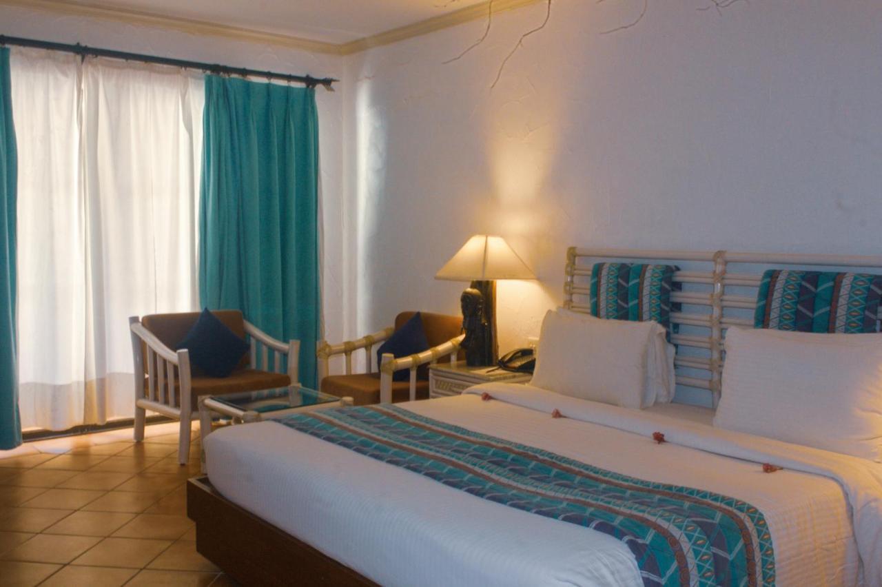 Diani Reef Beach Resort & Spa - Your Beachfront Bliss Awaits Diani Beach Exterior photo A room at the hotel